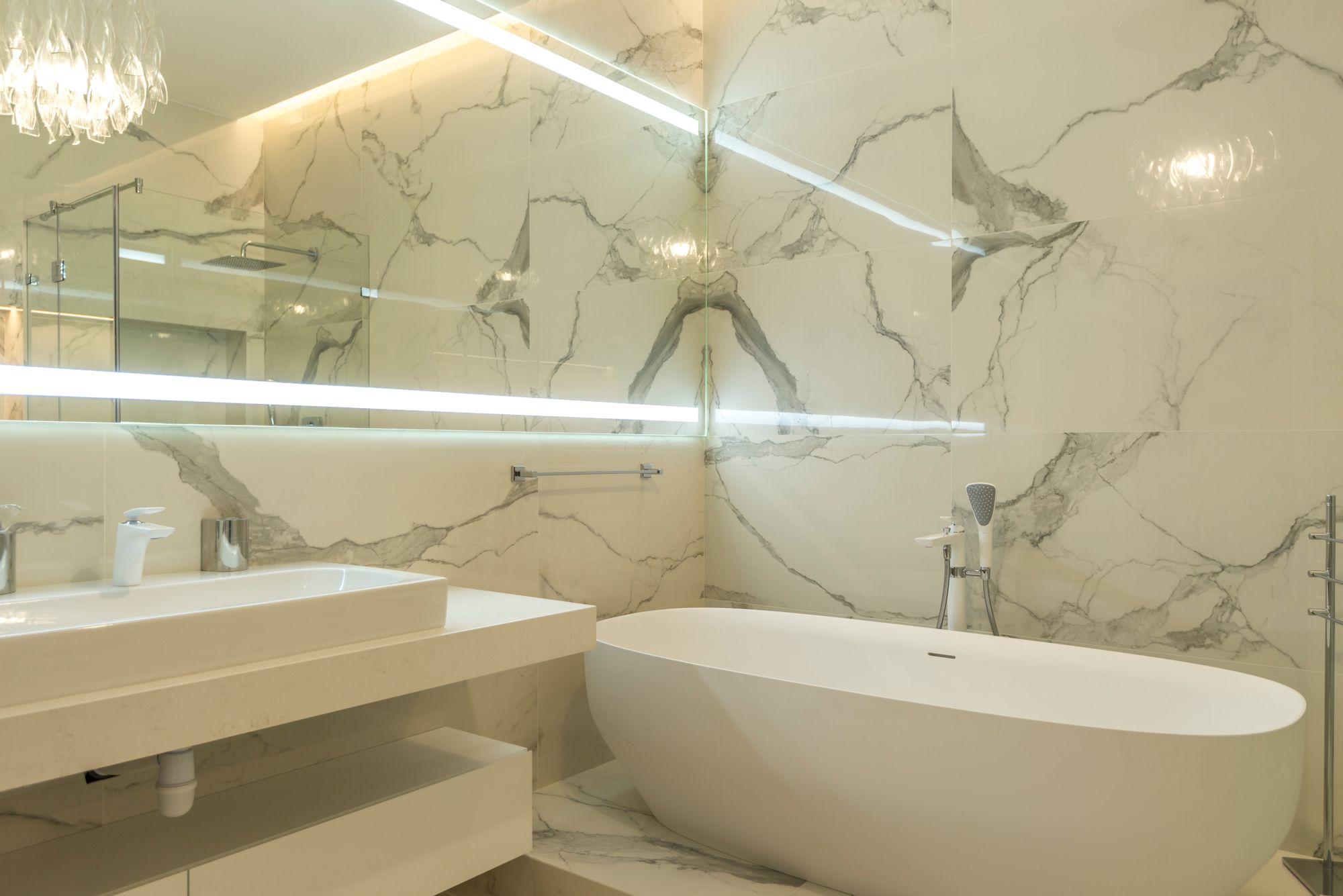 Refined bathroom renovation with marble surfaces